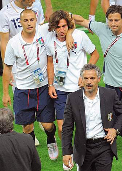 Euro 2008 (49).jpg - Coach of the Italian national football team Roberto Donadoni (R, down) reacts after Italy lost their Euro 2008 Championships quarter-final football match Spain vs. Italy on June 22, 2008 at Ernst Happel stadium in Vienna. Spain won the match 4-2 in penalty kicks after extra time had ended in a 0-0 draw.